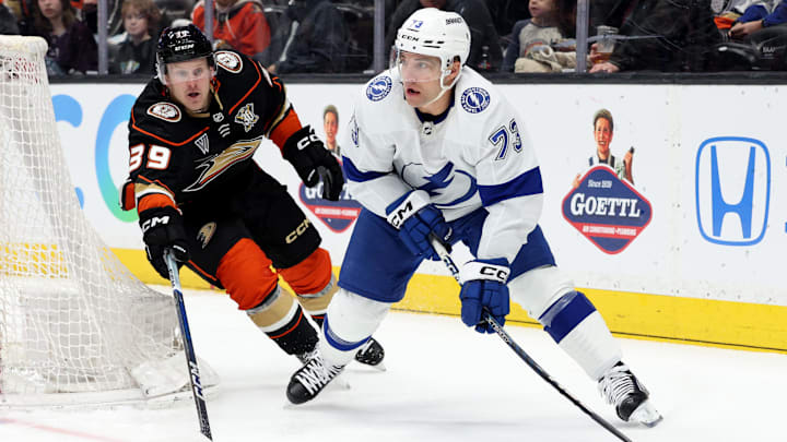 Mar 24, 2024; Anaheim, California, USA; Tampa Bay Lightning left wing Conor Sheary (73) passes from Anaheim Ducks center Ben Meyers (39) during the first period at Honda Center. Mandatory Credit: Jason Parkhurst-Imagn Images