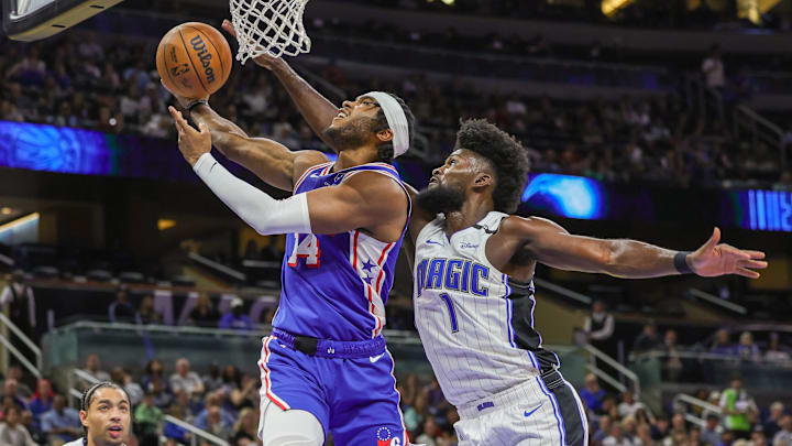 Philadelphia 76ers guard Ricky Council IV (14) goes to the basket against Orlando Magic forward Jonathan Isaac (1) during the second quarter at Kia Center.