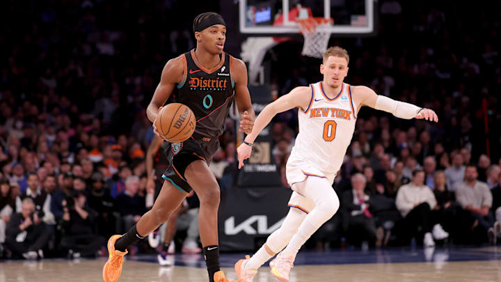 Jan 18, 2024; New York, New York, USA; Washington Wizards guard Bilal Coulibaly (0) brings the ball up court against New York Knicks guard Donte DiVincenzo (0) during the third quarter at Madison Square Garden. Mandatory Credit: Brad Penner-Imagn Images