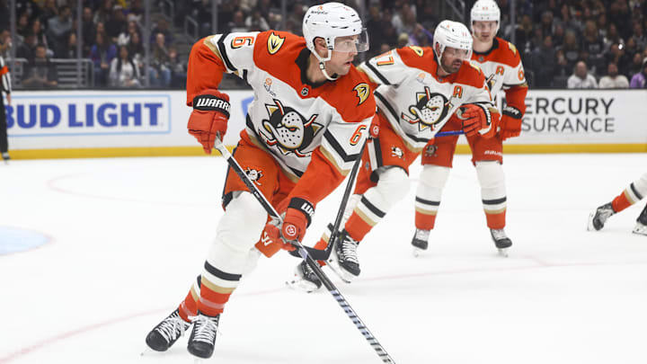 Feb 8, 2025; Los Angeles, California, USA; Anaheim Ducks defenseman Brian Dumoulin (6) skates with the puck against the Los Angeles Kings during the second period of a hockey game at Crypto.com Arena. Mandatory Credit: Jessica Alcheh-Imagn Images