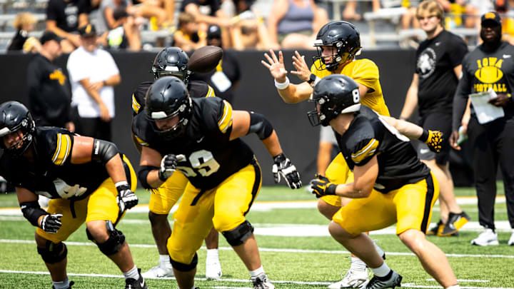 Aug 9, 2025; Iowa quarterback Mark Gronowski (11) catches a snap during the Hawkeyes Kids Day NCAA football open practice at Kinnick Stadium in Iowa City, Iowa. Mandatory Credit: Joseph Cress for the Des Moines Register