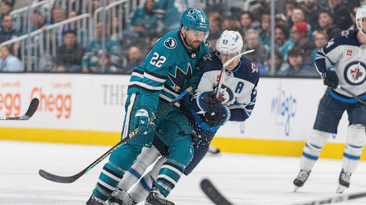 Jan 4, 2024; San Jose, California, USA; San Jose Sharks center Ryan Carpenter (22) collides into