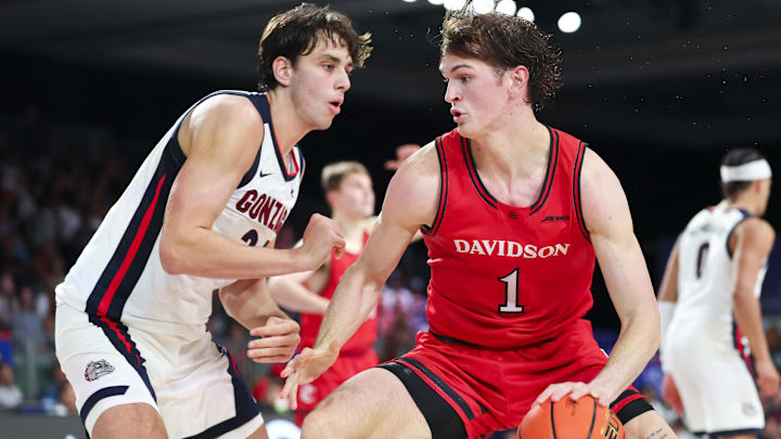 Nov 29, 2024; Paradise Island, Bahamas, BHS;  Davidson Wildcats forward Reed Bailey (1) dribbles as Gonzaga Bulldogs forward Braden Huff (34) defends during the second half at Imperial Arena at the Atlantis resort.  Mandatory Credit: Kevin Jairaj-Imagn Images