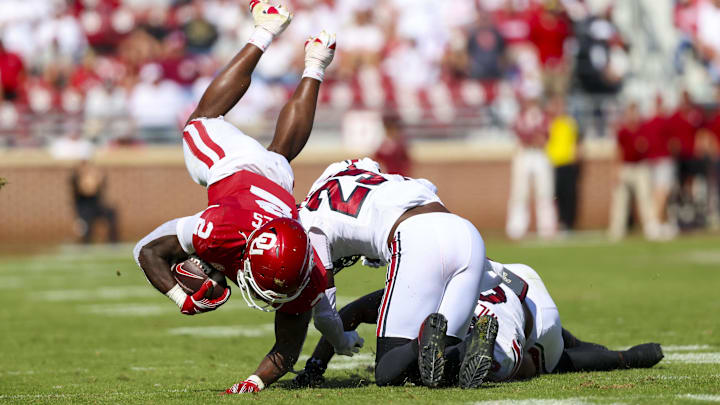 Oct 19, 2024; Norman, Oklahoma, USA; South Carolina Gamecocks defensive back David Spaulding (29) and South Carolina Gamecocks linebacker Debo Williams (0) tackle Oklahoma Sooners running back Jovantae Barnes (2) during the second half at Gaylord Family-Oklahoma Memorial Stadium. Mandatory Credit: Kevin Jairaj-Imagn Images Oct 19, 2024; Norman, Oklahoma, USA; South Carolina Gamecocks defensive back David Spaulding (29) and South Carolina Gamecocks linebacker Debo Williams (0) tackle Oklahoma Sooners running back Jovantae Barnes (2) during the second half at Gaylord Family-Oklahoma Memorial Stadium. Mandatory Credit: Kevin Jairaj-Imagn Images