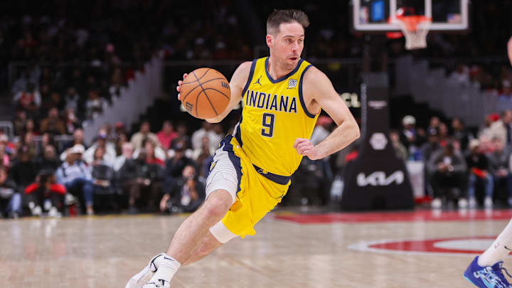 Mar 6, 2025; Atlanta, Georgia, USA; Indiana Pacers guard T.J. McConnell (9) drives to the basket against the Atlanta Hawks in the fourth quarter at State Farm Arena. Mandatory Credit: Brett Davis-Imagn Images