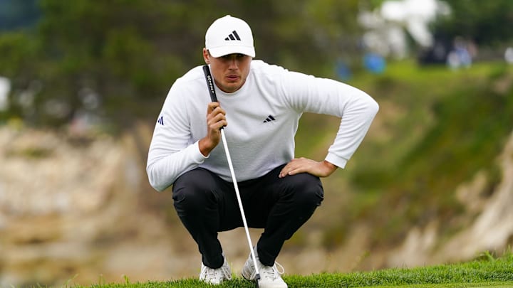Feb 3, 2024; Pebble Beach, California, USA; Ludvig Aberg lines up his putt on the fifth hole  during