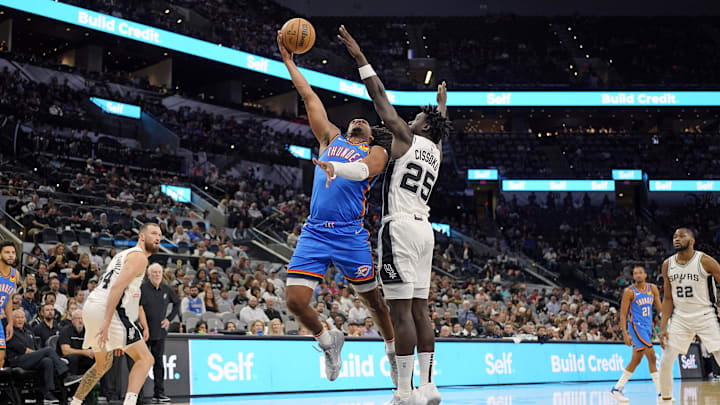 Oct 7, 2024; San Antonio, Texas, USA; Oklahoma City Thunder forward Dillon Jones (3) shoots over San Antonio Spurs guard Sidy Cissoko (25) during the second half at Frost Bank Center. Mandatory Credit: Scott Wachter-Imagn Images Oct 7, 2024; San Antonio, Texas, USA; Oklahoma City Thunder forward Dillon Jones (3) shoots over San Antonio Spurs guard Sidy Cissoko (25) during the second half at Frost Bank Center. Mandatory Credit: Scott Wachter-Imagn Images