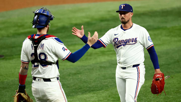 Texas Rangers relief pitcher Shawn Armstrong (43) celebrates with Texas Rangers catcher Jonah Heim (28) after the game against the Milwaukee Brewers at Globe Life Field. 