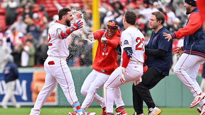 Apr 6, 2025; Boston, Massachusetts, USA;  Boston Red Sox outfielder Wilyer Abreu (52) gets sprayed with water by shortstop Ceddanne Rafaela (3)for his game winning RBI against the St. Louis Cardinals during the tenth inning at Fenway Park. Mandatory Credit: Eric Canha-Imagn Images