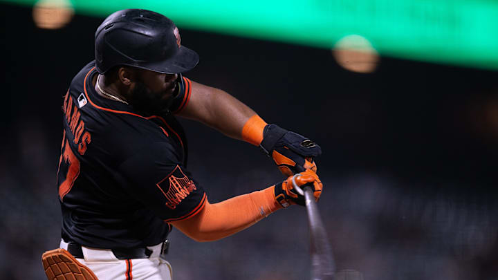 Mar 24, 2025; San Francisco, California, USA; San Francisco Giants left fielder Heliot Ramos (17) connects for an RBI single against the Detroit Tigers during the fifth inning at Oracle Park. 