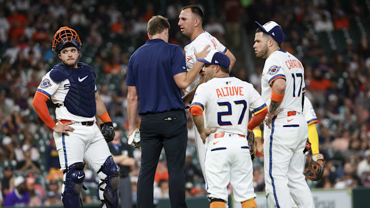 Jul 7, 2025; Houston, Texas, USA; A trainer looks at Houston Astros starting pitcher Colton Gordon (61) after he was hit in the head by a line drive by Cleveland Guardians left fielder Steven Kwan (not shown) in the fifth inning at Daikin Park. Jul 7, 2025; Houston, Texas, USA; A trainer looks at Houston Astros starting pitcher Colton Gordon (61) after he was hit in the head by a line drive by Cleveland Guardians left fielder Steven Kwan (not shown) in the fifth inning at Daikin Park.