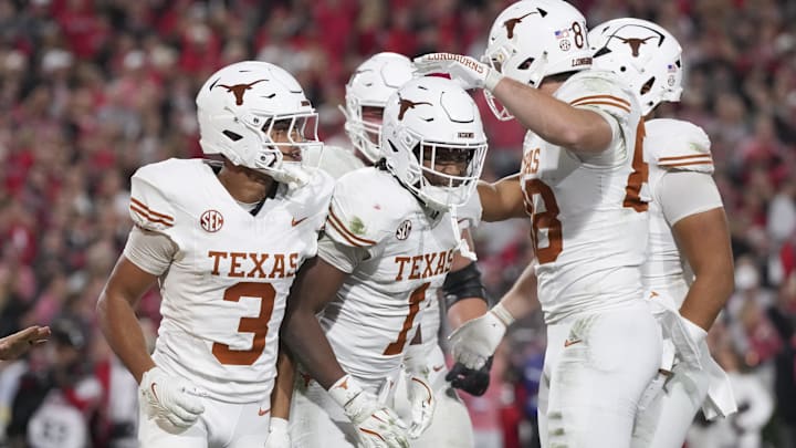 Texas Longhorns wide receiver Ryan Wingo celebrates scoring a touchdown with teammates in the second half against the Georgia Bulldogs at Sanford Stadium. 