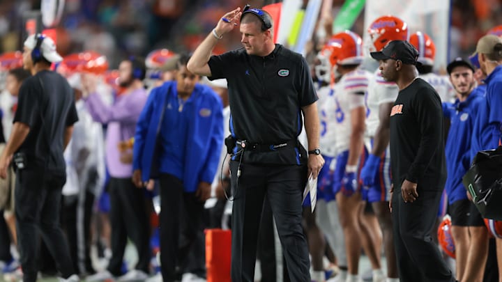 Sep 20, 2025; Miami Gardens, Florida, USA; Florida Gators head coach Billy Napier watches from the sideline against the Miami Hurricanes during the second quarter at Hard Rock Stadium. Mandatory Credit: Sam Navarro-Imagn Images