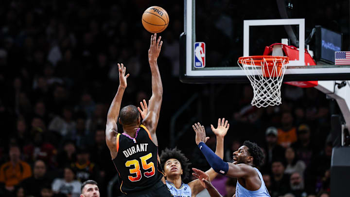 Dec 31, 2024; Phoenix, Arizona, USA; Phoenix Suns forward Kevin Durant (35) shoots the ball while Memphis Grizzlies forward-center Jaren Jackson Jr. (13) fails to block him during the second quarter of the game at Footprint Center. Mandatory Credit: Aryanna Frank-Imagn Images