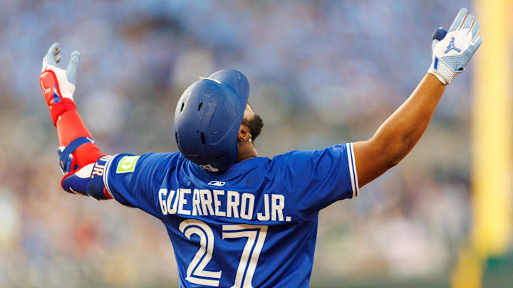 Sep 20, 2025; Kansas City, Missouri, USA; Toronto Blue Jays first base Vladimir Guerrero Jr. (27) reacts to a play during the fourth inning against the Kansas City Royals at Kauffman Stadium. 