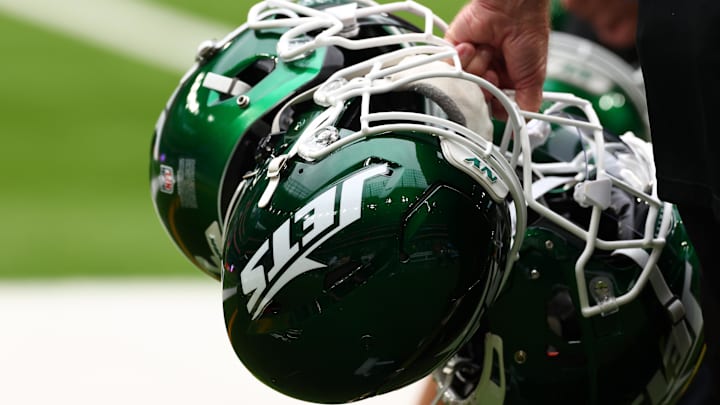 Oct 6, 2024; Tottenham, ENG; New York Jets helmets are held by staff before the match against Minnesota Vikings at Tottenham Hotspur Stadium. Mandatory Credit: Shaun Brooks-Imagn Images