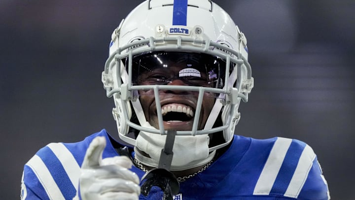 Indianapolis Colts cornerback Kenny Moore II celebrates after sacking Chicago Bears quarterback Caleb Williams.