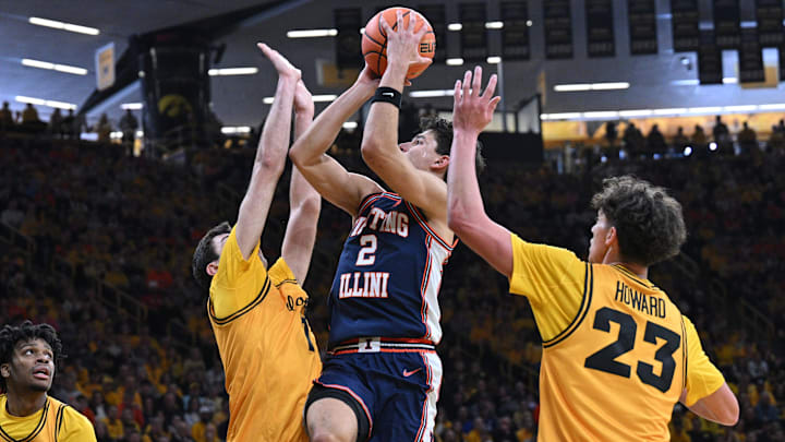 Jan 11, 2026; Iowa City, Iowa, USA; Illinois Fighting Illini guard Andrej Stojakovic (2) shoots the ball as Iowa Hawkeyes guard Isaia Howard (23) and forward Alvaro Folgueiras (7) and guard Isaia Howard (23) defend during the first half at Carver-Hawkeye Arena. Mandatory Credit: Jeffrey Becker-Imagn Images