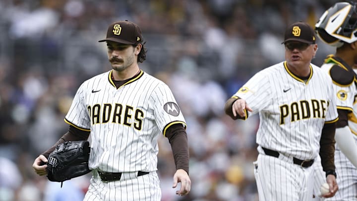 Jun 21, 2025; San Diego, California, USA; San Diego Padres starting pitcher Dylan Cease (84) leaves the game as manager Mie Shildt looks on during the seventh inning against the Kansas City Royals at Petco Park. Mandatory Credit: Denis Poroy-Imagn Images