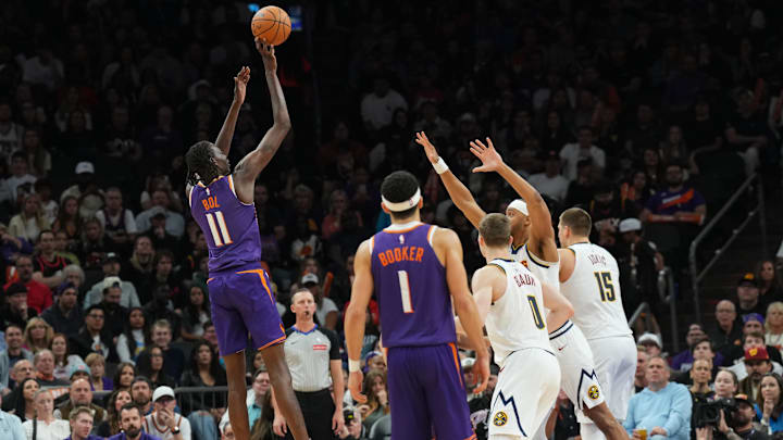 Feb 8, 2025; Phoenix, Arizona, USA; Phoenix Suns center Bol Bol (11) shoots against the Denver Nuggets during the second half at Footprint Center. Mandatory Credit: Joe Camporeale-Imagn Images