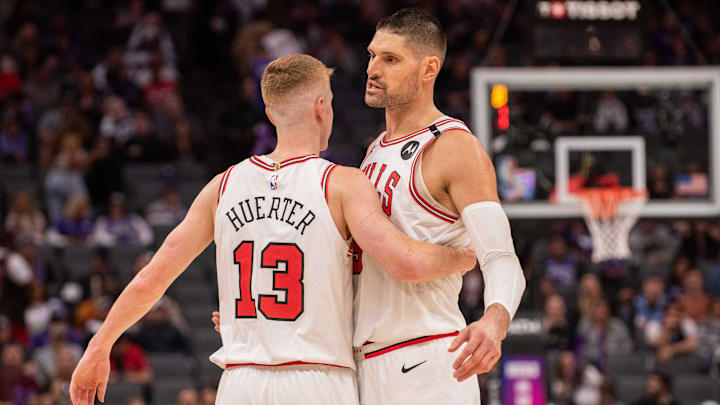 Mar 20, 2025; Sacramento, California, USA; Chicago Bulls guard Kevin Huerter (13) and center Nikola Vucevic (9) celebrate after defeating the Sacramento Kings at Golden 1 Center. Mandatory Credit: Ed Szczepanski-Imagn Images