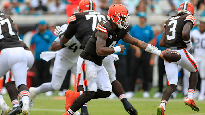 Cleveland Browns quarterback Deshaun Watson (4) hands off during the first quarter of an NFL football matchup Sunday, Sept. 15, 2024 at EverBank Stadium in Jacksonville, Fla. The Browns defeated the Jaguars 18-13. [Corey Perrine/Florida Times-Union]