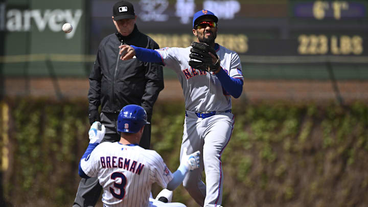 New York Mets second baseman Marcus Semien throws to first after forcing Chicago Cubs third baseman Alex Bregman.