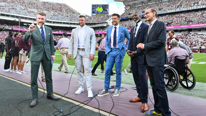 Sep 23, 2023; College Station, Texas, USA; SEC Nation crew speak on the sideline during pre-game between the Texas A&M Aggies and the Auburn Tigers; Marty Smith (far left, Tim Tebow (center left), Jordan Rodgers (center), Roman Harper (center right), Paul Finebaum (far right) at Kyle Field. Mandatory Credit: Maria Lysaker-USA TODAY Sports