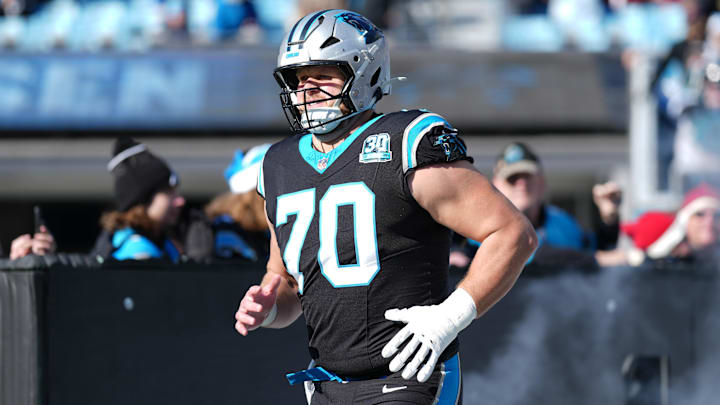 Dec 22, 2024; Charlotte, North Carolina, USA; Carolina Panthers guard Brady Christensen (70) takes the field during the first quarter against the Arizona Cardinals at Bank of America Stadium. Mandatory Credit: Jim Dedmon-Imagn Images
