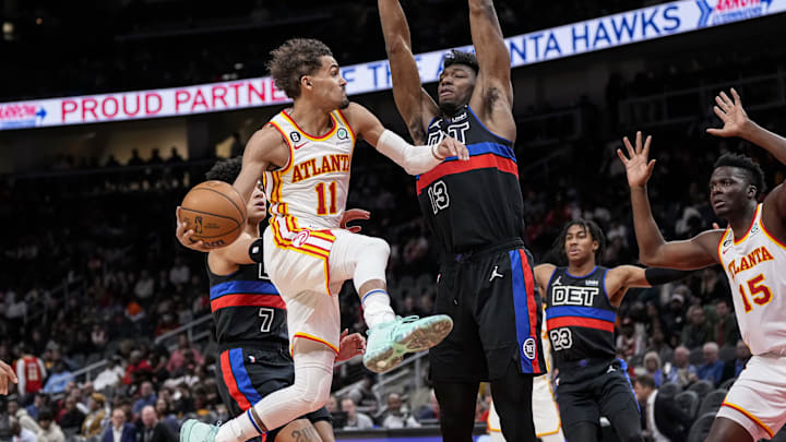 Mar 21, 2023; Atlanta, Georgia, USA; Atlanta Hawks guard Trae Young (11) passes around Detroit