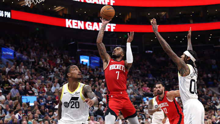 Oct 7, 2024; Salt Lake City, Utah, USA; Houston Rockets forward Cam Whitmore (7) goes to the basket between Utah Jazz forward John Collins (20) and guard Jordan Clarkson (00) during the third quarter at Delta Center. Mandatory Credit: Rob Gray-Imagn Images