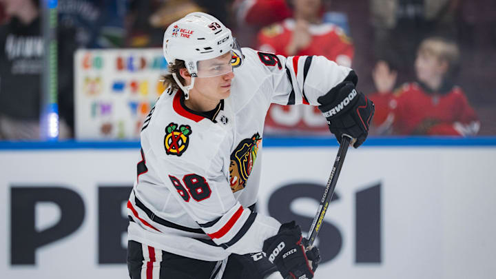 Mar 15, 2025; Vancouver, British Columbia, CAN; Chicago Blackhawks forward Connor Bedard (98) shoots during warm up prior to a game against the Vancouver Canucks at Rogers Arena. Mandatory Credit: Bob Frid-Imagn Images