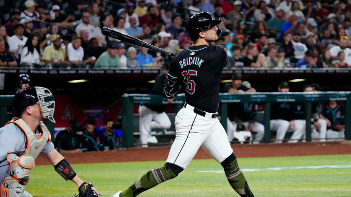 Diamondbacks Randal Grichuk (15) breaks up the no-hitter with a double in the fifth inning against the Tigers during a game at Chase Field on Friday, May 17, 2024.