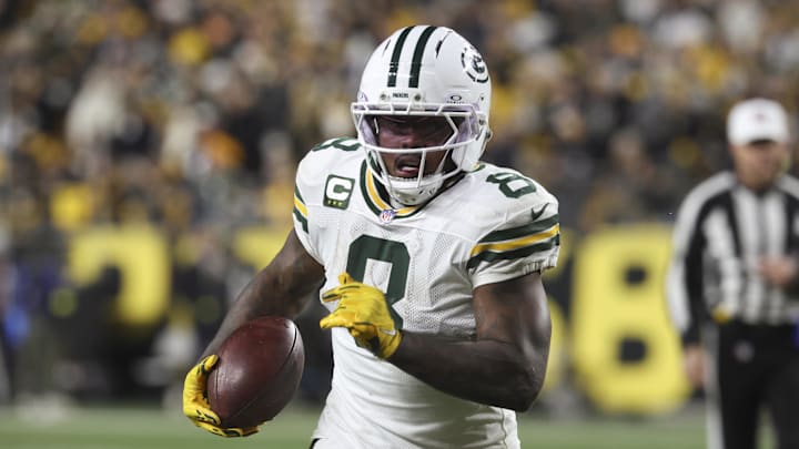 Green Bay Packers running back Josh Jacobs (8) runs the ball against the Pittsburgh Steelers during the fourth quarter against at Acrisure Stadium. 