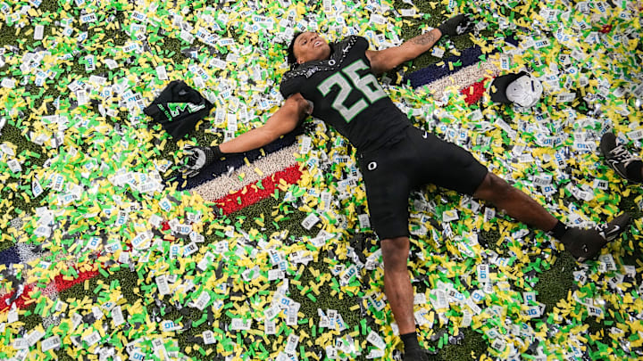 Oregon linebacker Devon Jackson celebrates after the Ducks won the Big Ten championship.