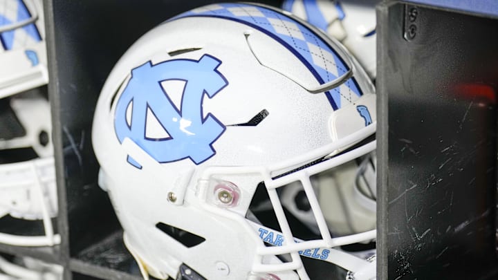 Dec 27, 2023; Charlotte, NC, USA; North Carolina Tar Heels white helmet during pregame warm ups against the West Virginia Mountaineers at Bank of America Stadium. Mandatory Credit: Jim Dedmon-Imagn Images