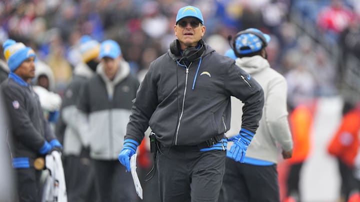 Dec 28, 2024; Foxborough, Massachusetts, USA; Los Angeles Chargers head coach Jim Harbaugh looks up at the scoreboard from the sidelines during the first half against the New England Patriots at Gillette Stadium. Mandatory Credit: Gregory Fisher-Imagn Images