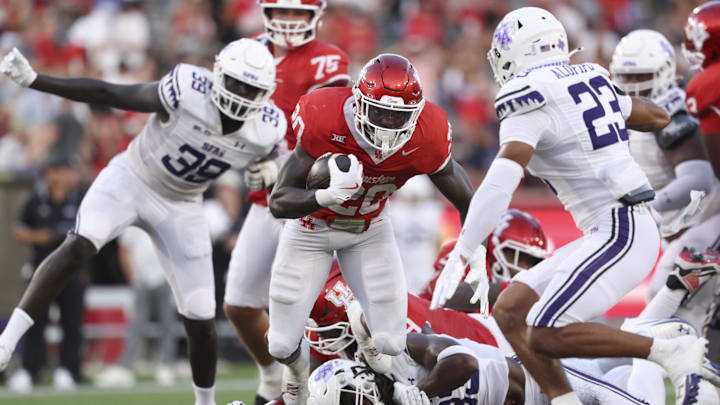 Aug 28, 2025; Houston, Texas, USA; Houston Cougars running back J'Marion Burnette (20) runs with the ball during the first quarter against the Stephen F. Austin Lumberjacks at TDECU Stadium. Mandatory Credit: Troy Taormina-Imagn Images