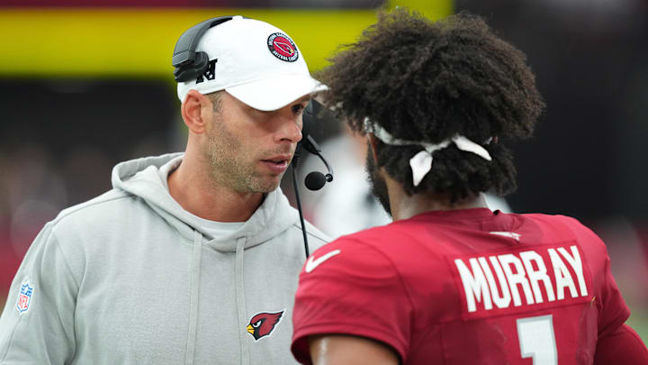 Sep 15, 2024; Glendale, Arizona, USA; Arizona Cardinals head coach Jonathan Gannon talks with Arizona Cardinals quarterback Kyler Murray (1) during the second half against the Los Angeles Rams at State Farm Stadium. Mandatory Credit: Joe Camporeale-Imagn Images Sep 15, 2024; Glendale, Arizona, USA; Arizona Cardinals head coach Jonathan Gannon talks with Arizona Cardinals quarterback Kyler Murray (1) during the second half against the Los Angeles Rams at State Farm Stadium. Mandatory Credit: Joe Camporeale-Imagn Images