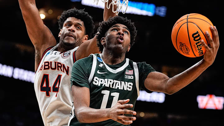 Michigan State guard Jase Richardson (11) goes to the basket against Auburn center Dylan Cardwell (44) during the second half of the Elite Eight round of NCAA tournament at State Farm Arena in Atlanta, Ga. on Sunday, March 30, 2025.