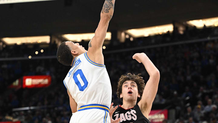 Dec 28, 2024; Inglewood, California, USA; UCLA Bruins guard Kobe Johnson (0) blocks a shot by Gonzaga Bulldogs forward Braden Huff (34) during the second half at Intuit Dome. Mandatory Credit: Robert Hanashiro-Imagn Images Dec 28, 2024; Inglewood, California, USA; UCLA Bruins guard Kobe Johnson (0) blocks a shot by Gonzaga Bulldogs forward Braden Huff (34) during the second half at Intuit Dome. Mandatory Credit: Robert Hanashiro-Imagn Images