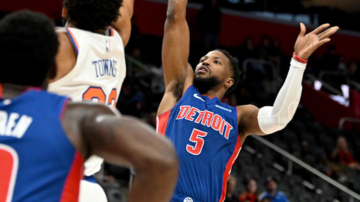Nov 1, 2024; Detroit, Michigan, USA; Detroit Pistons guard Malik Beasley (5) shoots the ball over New York Knicks center Karl-Anthony Towns (32) in the first quarter at Little Caesars Arena. Mandatory Credit: Lon Horwedel-Imagn Images