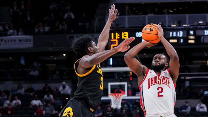 Ohio State Buckeyes guard Bruce Thornton (2) attempts a 3-pointer against Iowa Hawkeyes guard Drew Thelwell (3) on Wednesday, March 12, 2025, in a first round game at the 2025 TIAA Big Ten Men’s Basketball Tournament between the Iowa Hawkeyes and the Ohio State Buckeyes at Gainbridge Fieldhouse in Indianapolis. Ohio State Buckeyes guard Bruce Thornton (2) attempts a 3-pointer against Iowa Hawkeyes guard Drew Thelwell (3) on Wednesday, March 12, 2025, in a first round game at the 2025 TIAA Big Ten Men’s Basketball Tournament between the Iowa Hawkeyes and the Ohio State Buckeyes at Gainbridge Fieldhouse in Indianapolis.