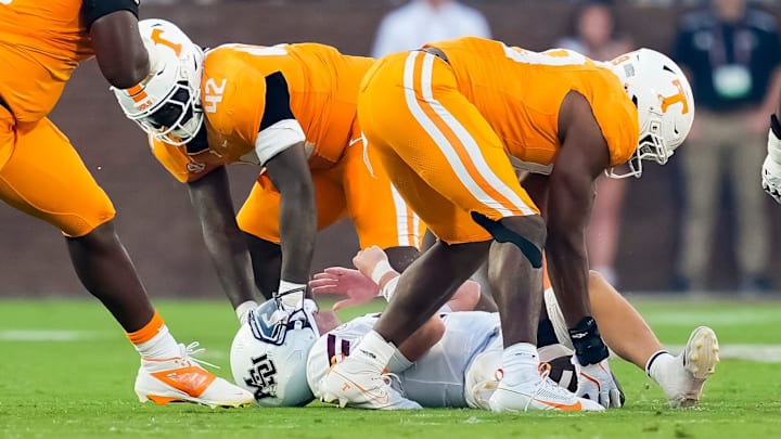 Tennessee defensive lineman Joshua Josephs (19) picks up a fumbled ball after Mississippi State quarterback Blake Shapen (2) is sacked by Tennessee defensive lineman Tyre West (42) during a college football game between Tennessee and Mississippi State at Davis Wade Stadium in Starkville, Miss., on Sept. 27, 2025.