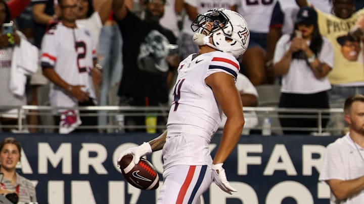 Aug 31, 2024; Tucson, Arizona, USA; Arizona Wildcats wide receiver Tetairoa McMillan (4) celebrates a touchdown during first quarter at Arizona Stadium. Aug 31, 2024; Tucson, Arizona, USA; Arizona Wildcats wide receiver Tetairoa McMillan (4) celebrates a touchdown during first quarter at Arizona Stadium.