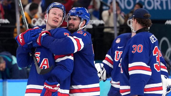 Feb 18, 2026; Milan, Italy; Brady Tkachuk of United States and Dylan Larkin of United States celebrate after the match against Sweden in a men's ice hockey quarterfinal during the Milano Cortina 2026 Olympic Winter Games at Milano Santagiulia Ice Hockey Arena. Mandatory Credit: Amber Searls-Imagn Images