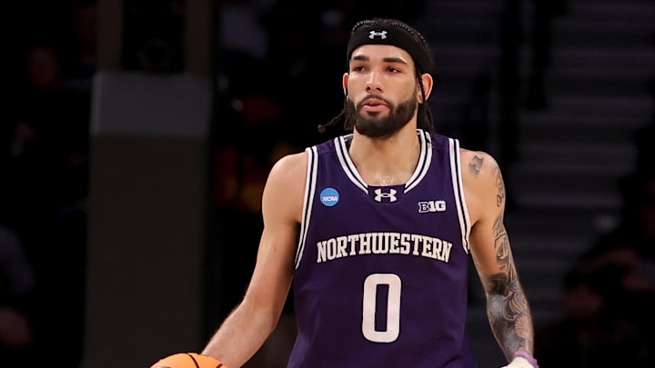 Mar 24, 2024; Brooklyn, NY, USA; Northwestern Wildcats guard Boo Buie (0) brings the ball up court against the Connecticut Huskies during the second half at Barclays Center. Mandatory Credit: Brad Penner-Imagn Images Mar 24, 2024; Brooklyn, NY, USA; Northwestern Wildcats guard Boo Buie (0) brings the ball up court against the Connecticut Huskies during the second half at Barclays Center. Mandatory Credit: Brad Penner-Imagn Images
