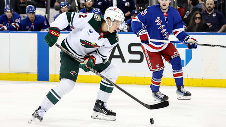 Apr 2, 2025; New York, New York, USA;  Minnesota Wild left wing Matt Boldy (12) controls the puck in the first period against the New York Rangers at Madison Square Garden. Mandatory Credit: Wendell Cruz-Imagn Images