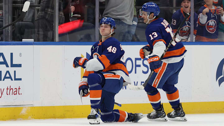 Jan 3, 2026; Elmont, New York, USA; New York Islanders defenseman Matthew Schaefer (48) celebrates with New York Islanders center Mathew Barzal (13) after scoring a goal against the Toronto Maple Leafs during the third period at UBS Arena. Mandatory Credit: Thomas Salus-Imagn Images