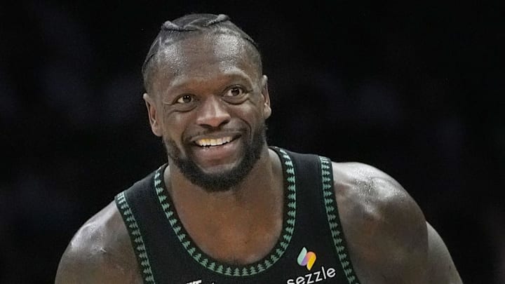 Jan 6, 2026; Minneapolis, Minnesota, USA; Minnesota Timberwolves forward Julius Randle (30) celebrates his three-point basket against the Miami Heat that beat the shot clock in the third quarter at Target Center. Mandatory Credit: Bruce Kluckhohn-Imagn Images